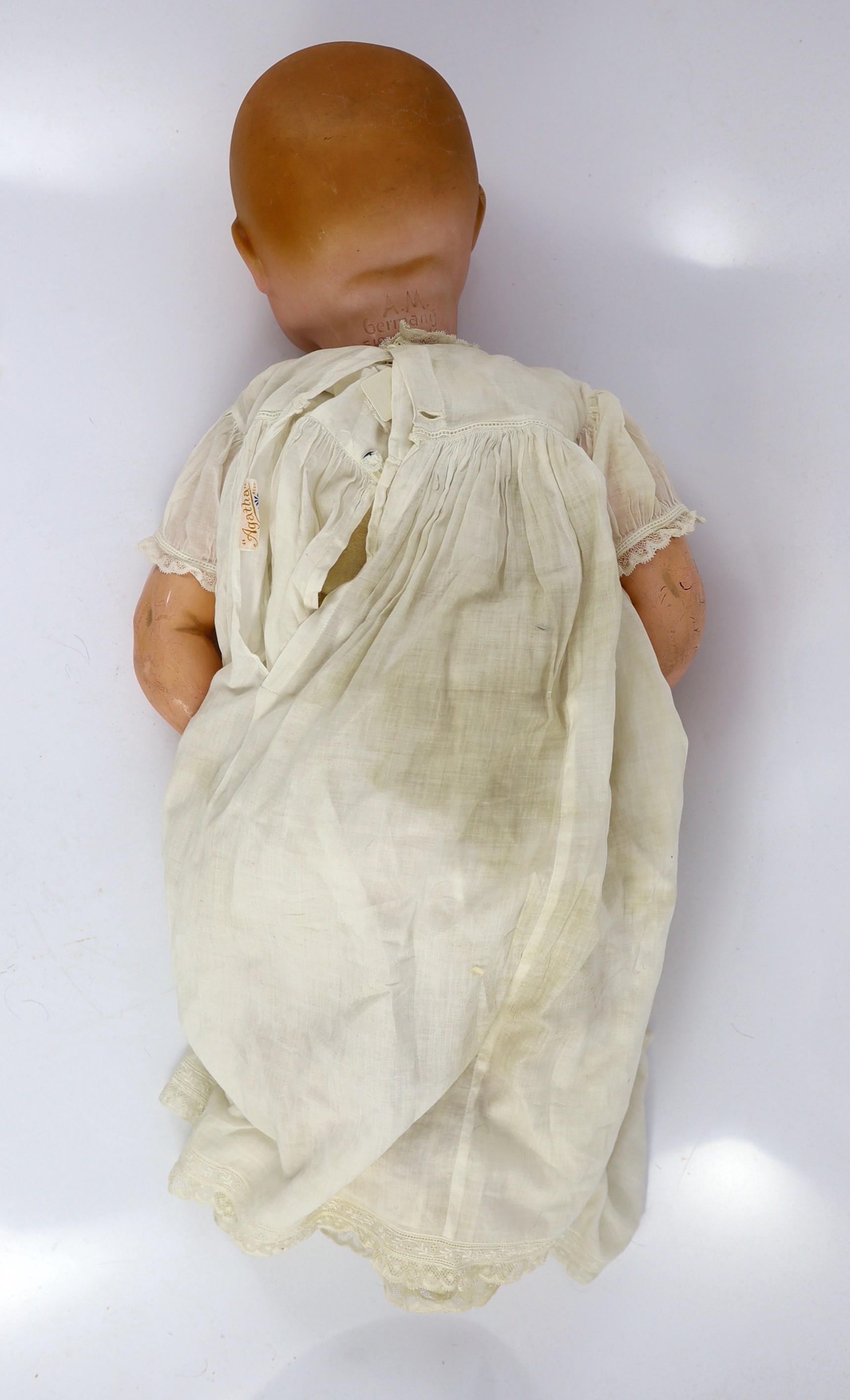 A Heinrich Handwerck bisque doll, German, circa 1900, 18in. and 23in. resp.